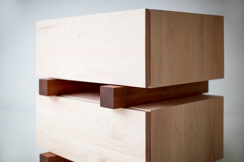 Front view of a Santa Fe maple nightstand showing its chunky drawer design