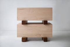 Side angle of a modern maple nightstand highlighting its caramel wood tone
