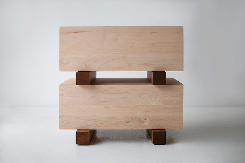 Side angle of a modern maple nightstand highlighting its caramel wood tone