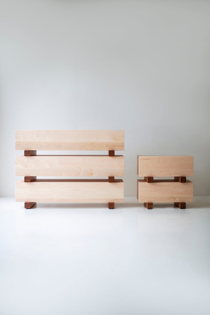 Close-up of the push-to-open drawer and dovetail joinery on a maple nightstand