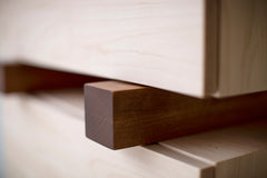 Santa Fe maple nightstand styled beside a bed with a lamp