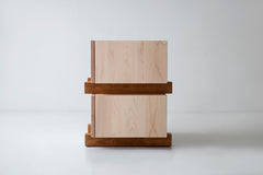 Angled view of a modern nightstand showing its matte commercial-grade finish