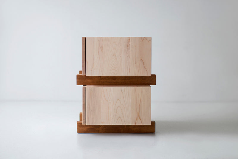 Angled view of a modern nightstand showing its matte commercial-grade finish