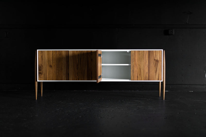Modern luxury teak Cambre credenza styled in a modern living room