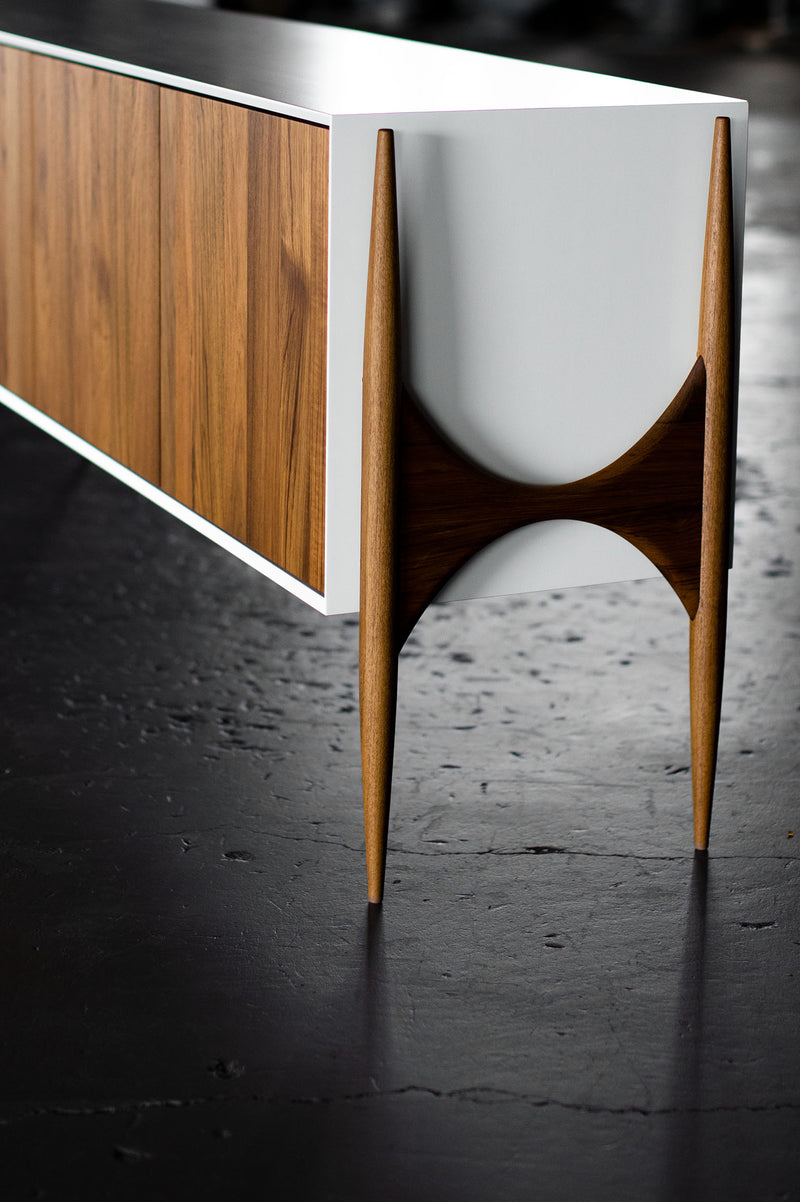 Modern luxury teak Cambre credenza shown with its cabinet doors open