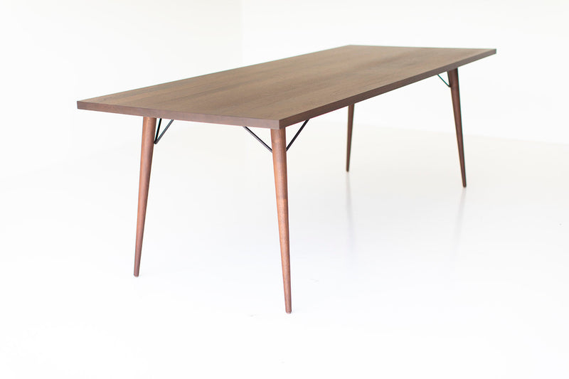 Modern luxury New York walnut dining table styled in a dining room