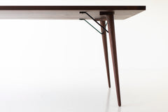 Angled view of the modern luxury New York walnut table