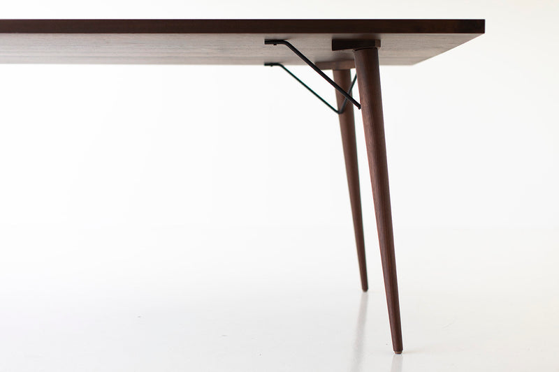 Angled view of the modern luxury New York walnut table