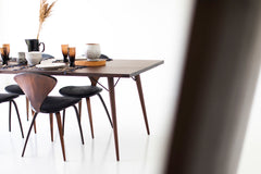 Modern luxury New York dining table shown with chairs around it