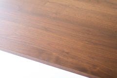 Modern luxury New York walnut table shown from above displaying the grain
