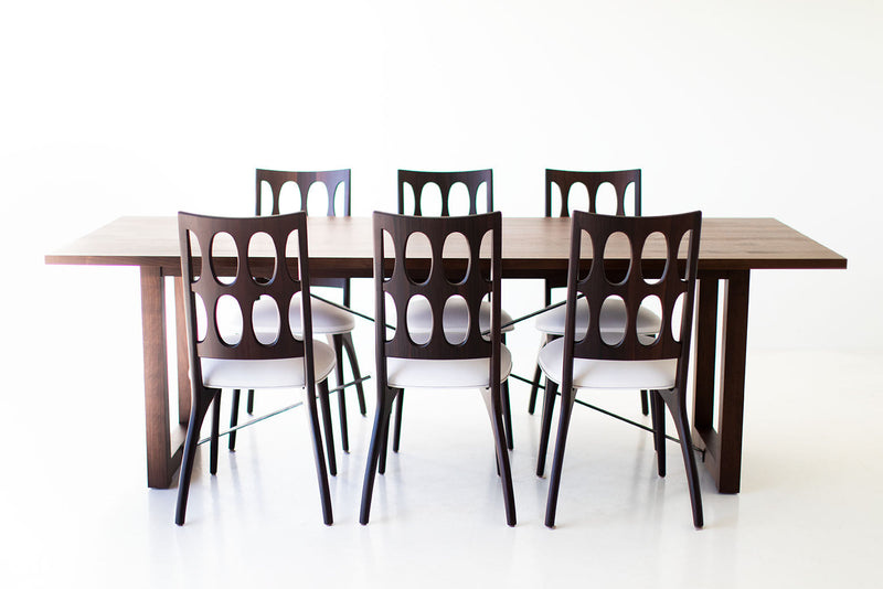 Modern luxury walnut dining table styled with place settings