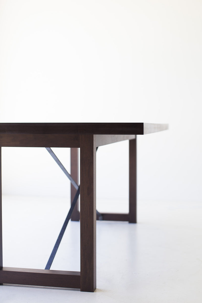 Modern luxury walnut dining table styled in a modern dining room
