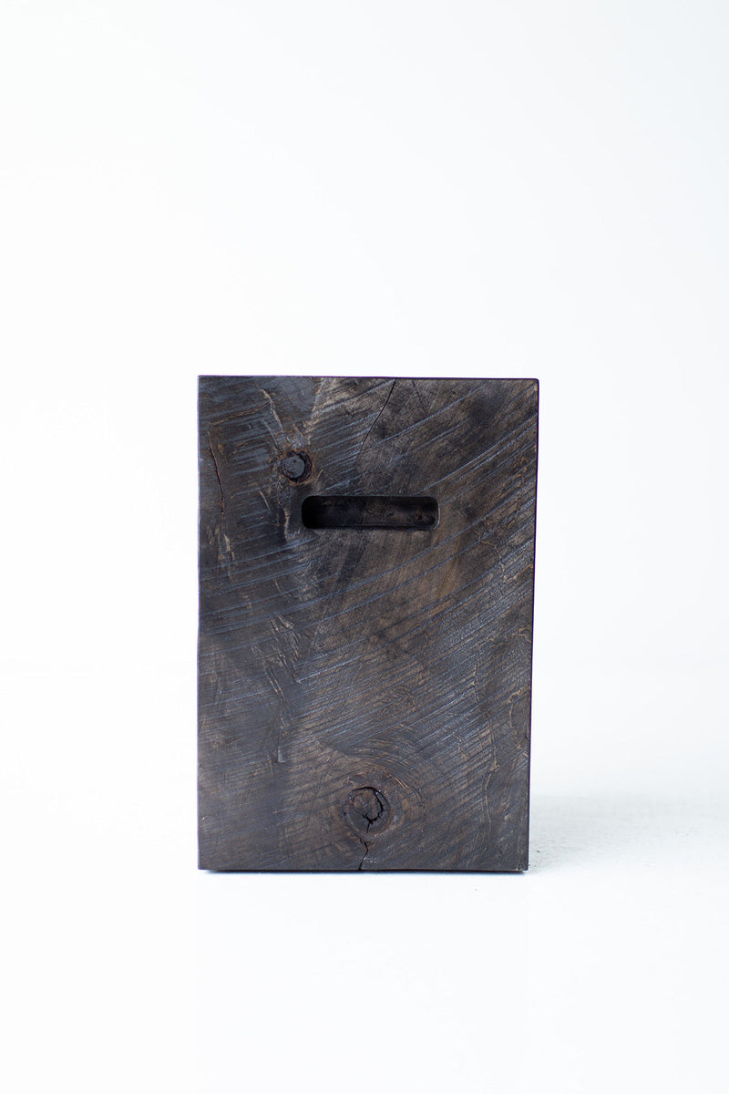 Overhead view of the side table's round natural wood top