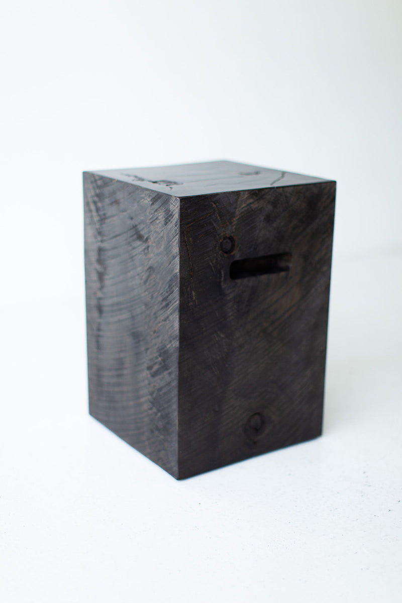 Angled view of the wood side table displaying its organic character