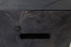 Detail shot of a cutout handle on the wood side table