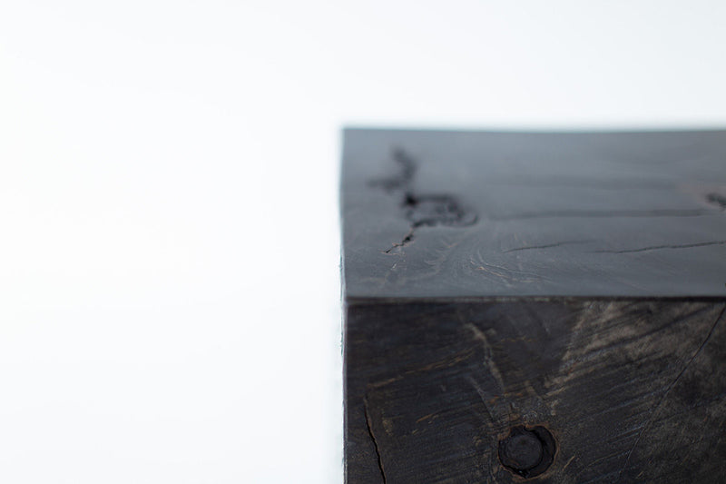 Close-up of the aged commercial grade finish on the wood side table