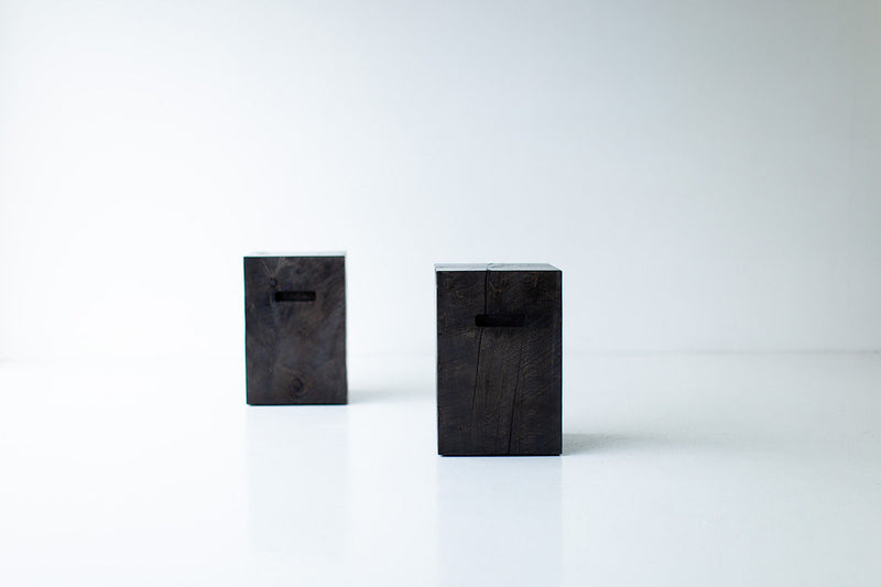 Full view of the modern wood side table with cutouts against a neutral backdrop