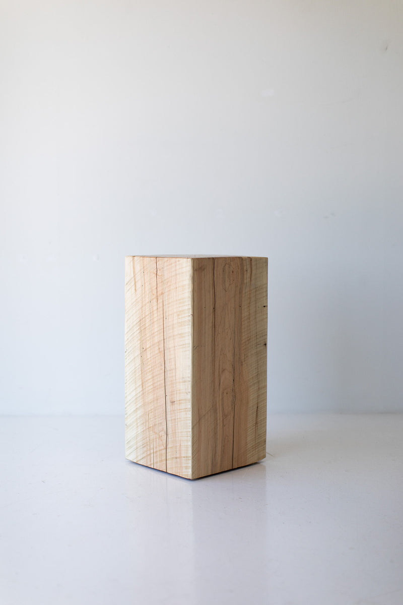 Overhead view of the tree stump table's round top showing the natural growth rings