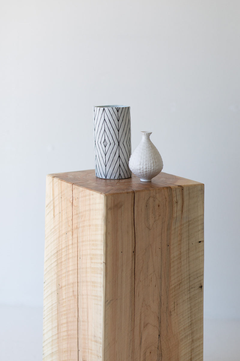 Angled view of the natural tree stump table displaying its rich wood tone and texture