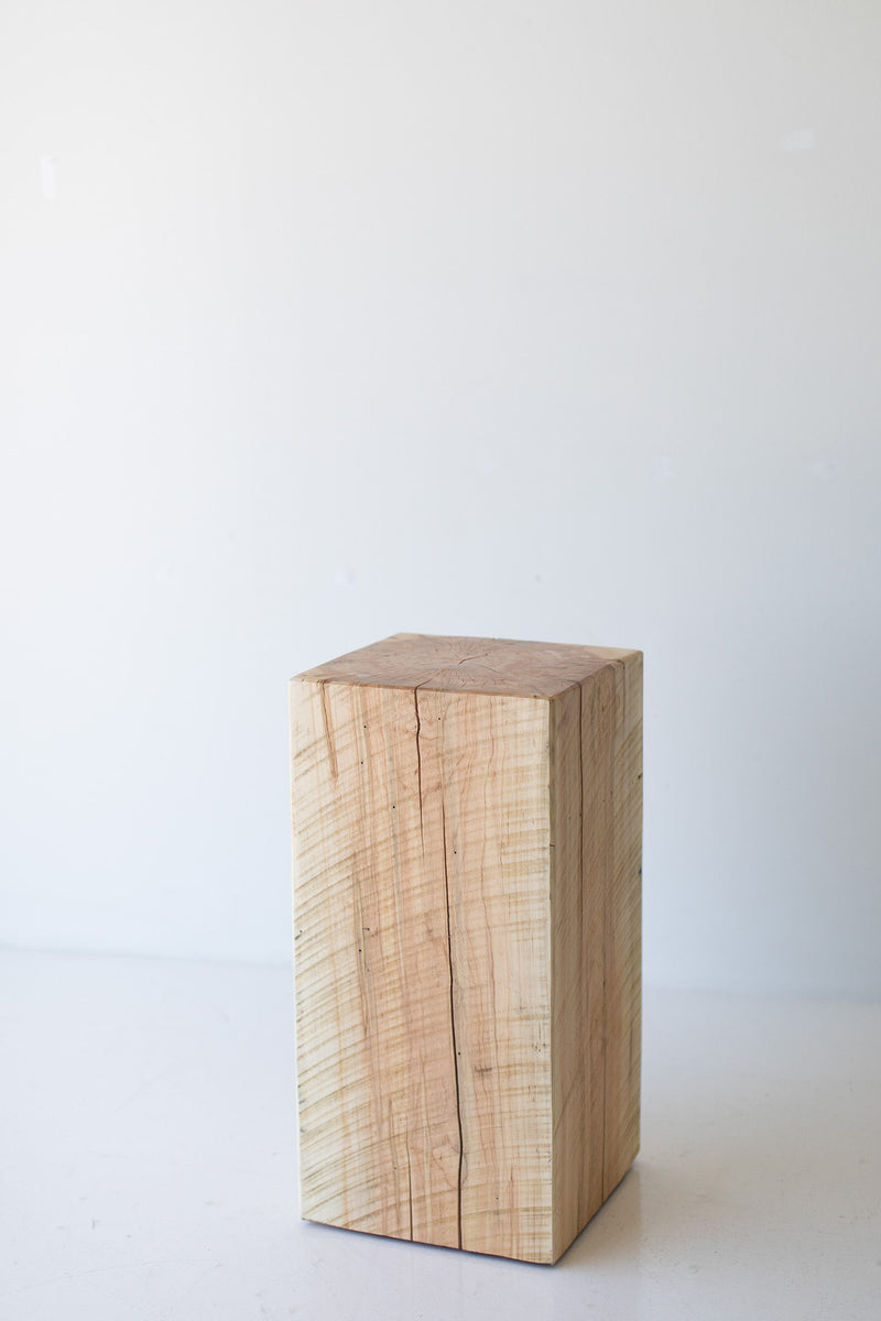 Three tree stump side tables grouped together in graduated heights for a layered look