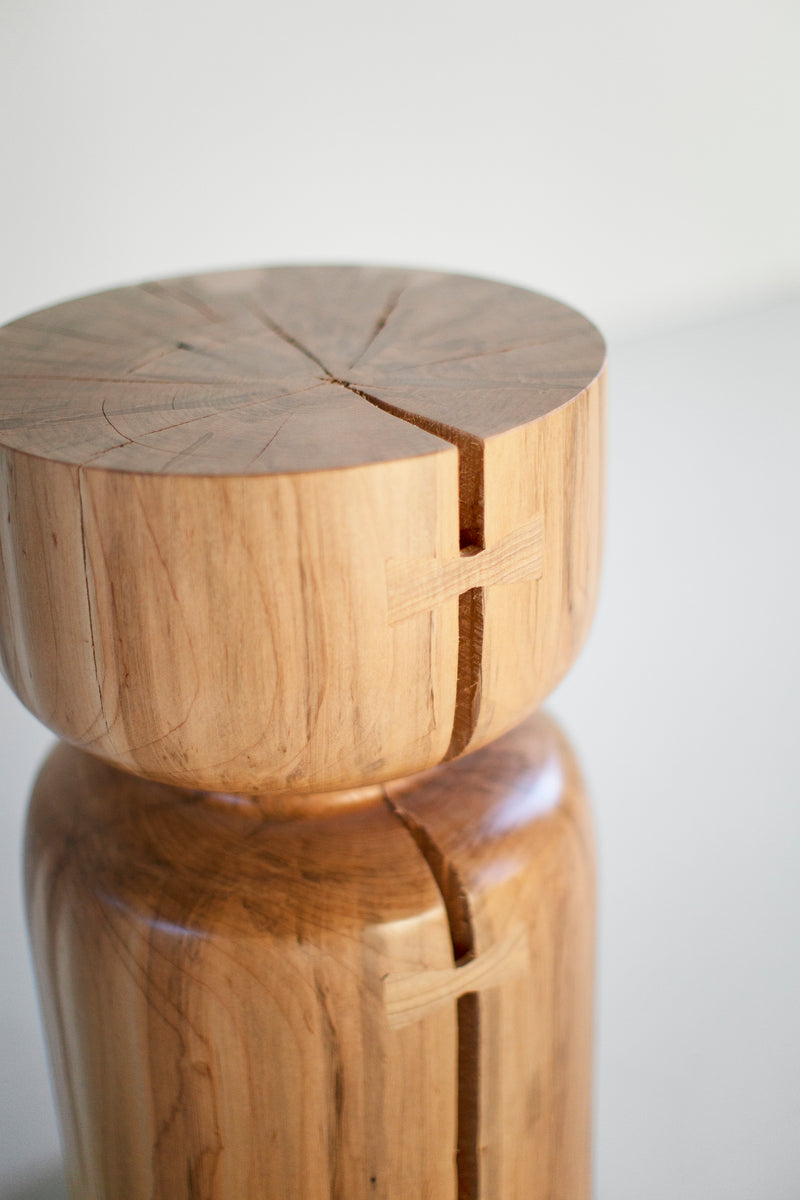 Front view of a Roma counter stool showing its natural wood finish