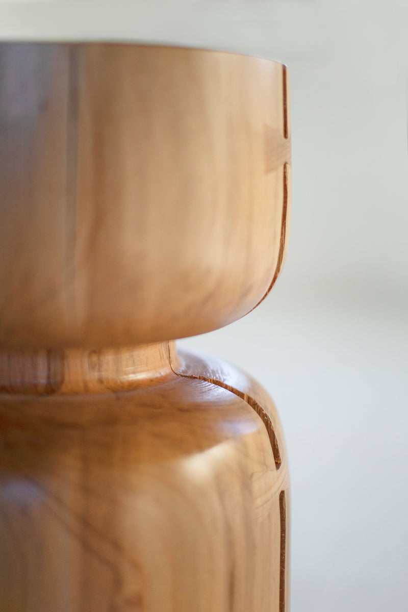Natural wood counter stool styled at a kitchen island