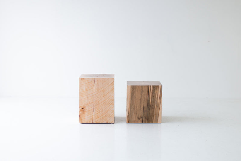 Two natural maple block end tables side by side