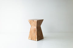 The Sol natural wood end table hand sculpted from a solid maple trunk