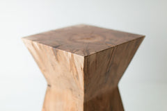Close-up of the natural wood grain on the Sol end table's top