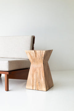 Side profile of the Sol end table showing its tall, organic form