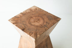 Overhead view of the Sol end table's round natural wood top