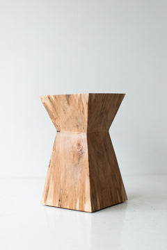 Angled view of the Sol end table displaying its organic character