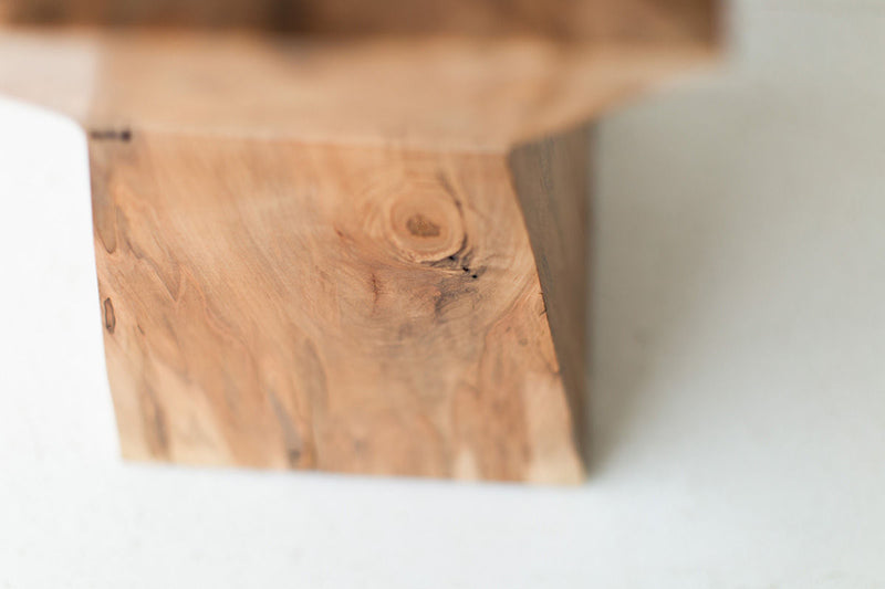 Detail shot of the hand-chipped bark edge on the Sol end table
