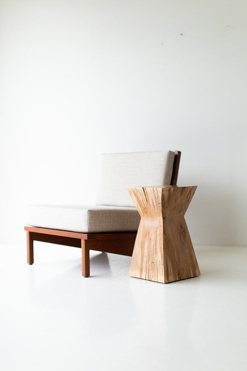 Full view of the natural wood Sol end table against a neutral backdrop