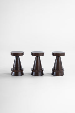 The Outdoor Boca counter stool in exterior walnut finish in a sunlit outdoor living space.