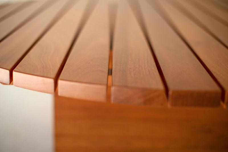 Detail of the joinery on a round outdoor mahogany coffee table