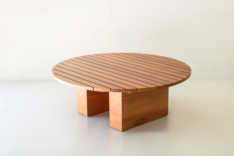 Round Suelo coffee table styled with outdoor sofas and pillows