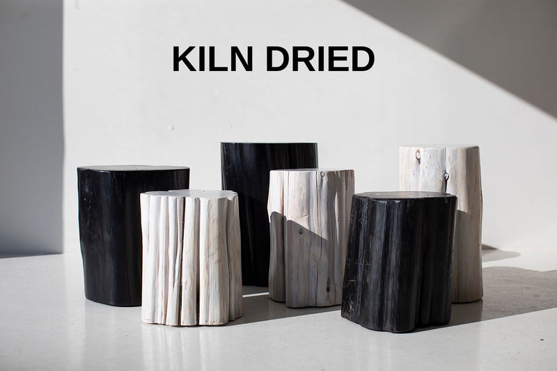 Black and whitewash outdoor red cedar stump tables grouped together