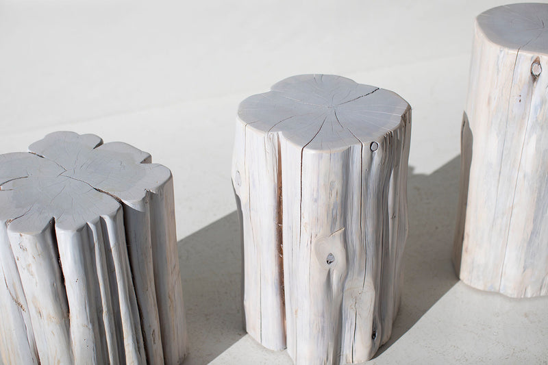 Three whitewash outdoor red cedar stump tables