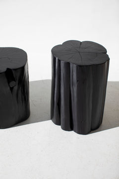 Two glossy black outdoor red cedar stump tables