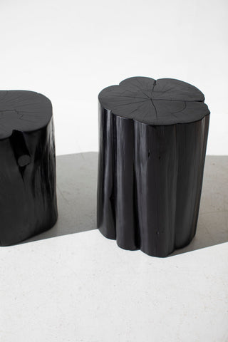Two glossy black outdoor red cedar stump tables