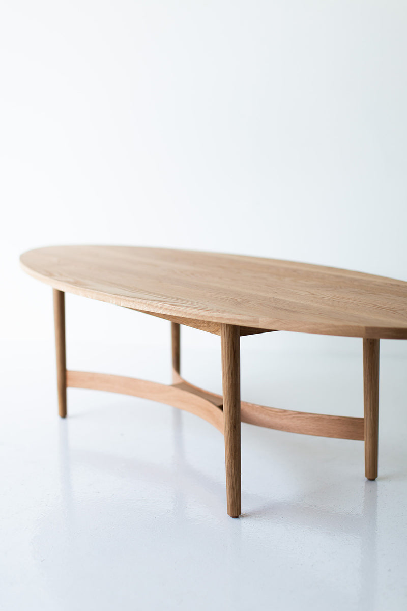 Side profile of the oak coffee table showing its low silhouette