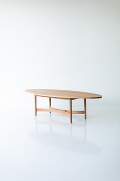 Full view of the Peabody oak coffee table against a neutral backdrop