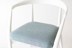 White lacquer finish on the maple frame of the Peabody modern dining armchair