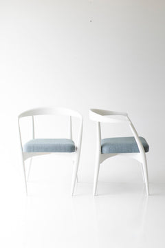 Modern luxury white maple dining chairs styled around a dining table