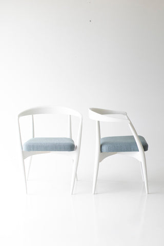 Modern luxury white maple dining chairs styled around a dining table
