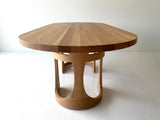 Modern luxury oak dining table by Craft Associates®, long Barricas design shown in a bright dining space
