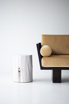Whitewash red cedar stump beside a sofa