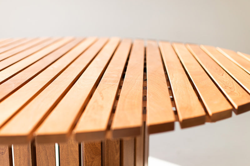 Bertu Home round outdoor dining table shown at an angle