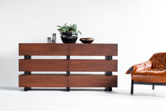 Side profile of a modern luxury walnut dresser highlighting blackened beam accents